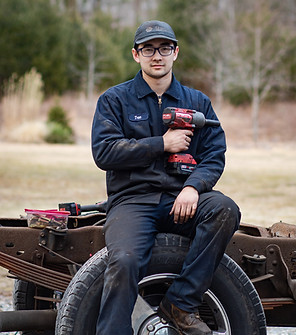 True Smith on a lawn tractor